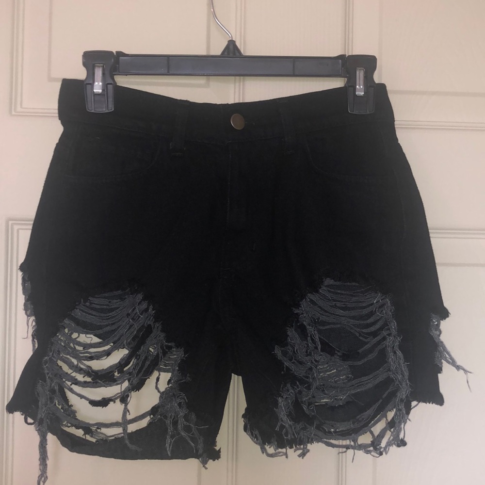 Torn denim shorts